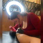 Gracie tattooing a client